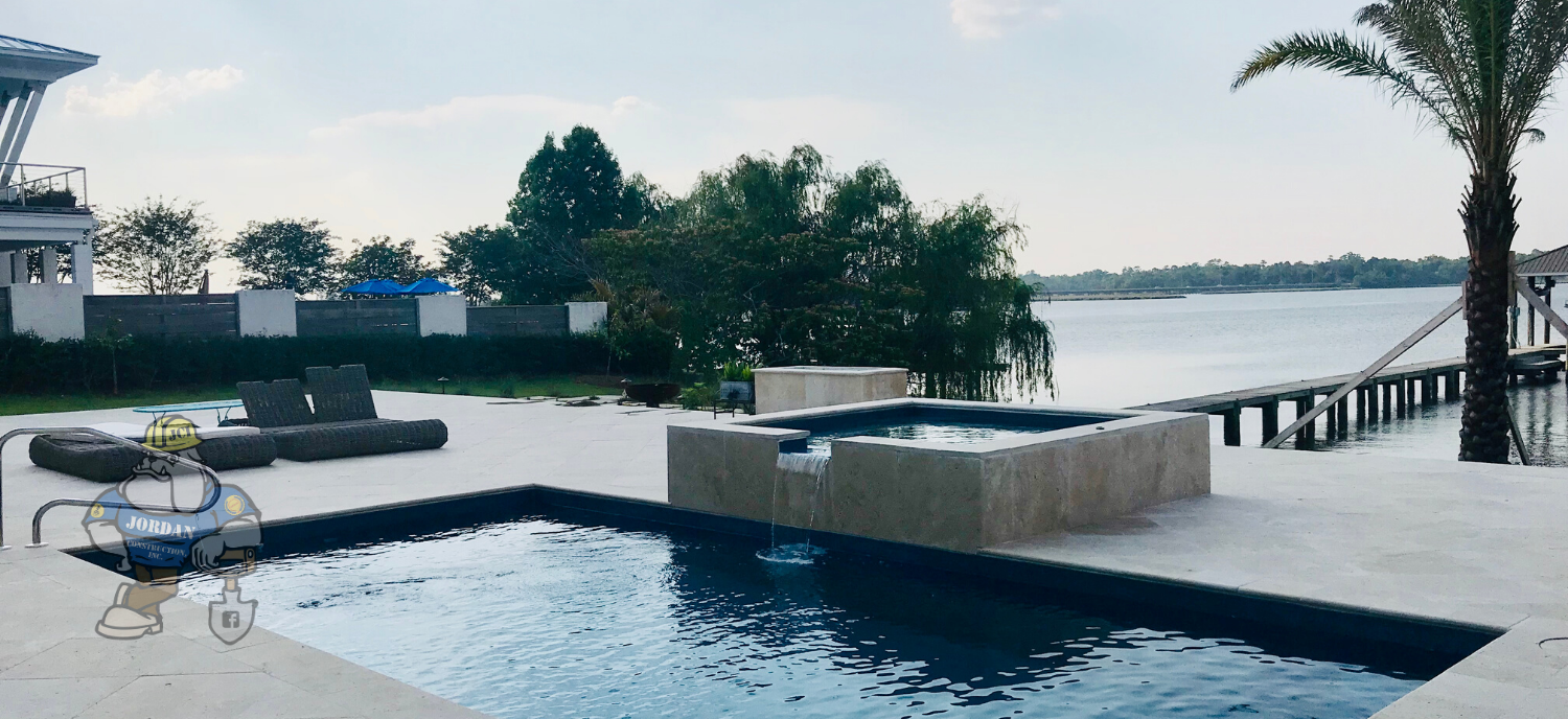 pool with waterfall and hot tub